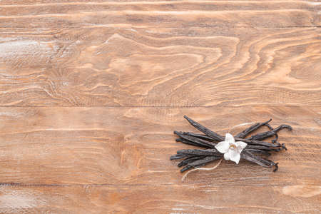 Aromatic vanilla sticks on wooden backgroundの写真素材