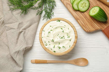 Composition with tasty sour cream on tableの写真素材