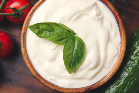 Bowl of tasty sour cream on table, closeupの写真素材