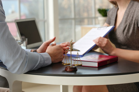 Man visiting lawyer in officeの写真素材