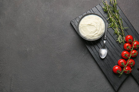 Composition with tasty sour cream on tableの写真素材