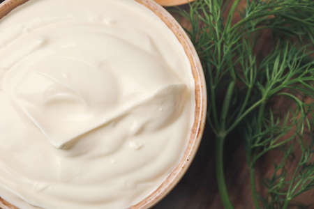 Bowl of tasty sour cream on table, closeupの写真素材