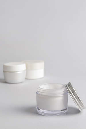 Jars of cream on light backgroundの写真素材