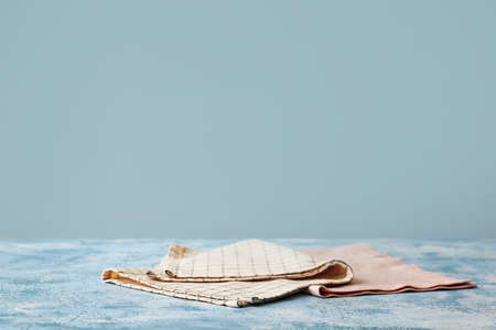 Napkins on table against color backgroundの写真素材