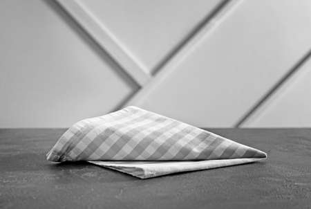 Napkin on table against light backgroundの写真素材