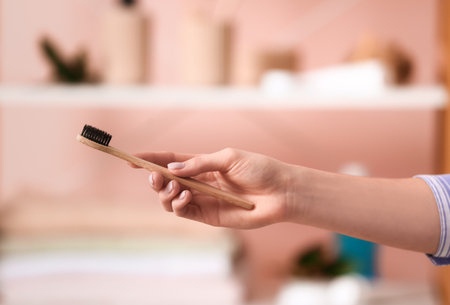 Woman with tooth brush in bathroomの写真素材