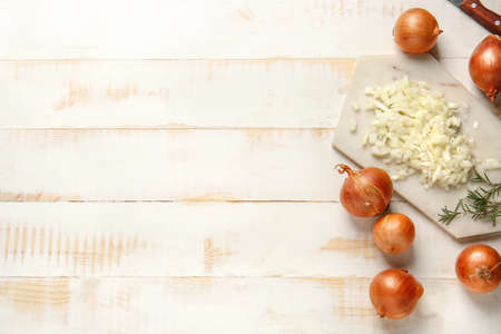 Composition with fresh raw onion on wooden tableの写真素材