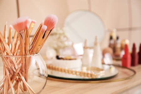 Different cosmetics on table of makeup artistの写真素材