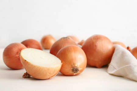 Fresh raw onion on white tableの写真素材