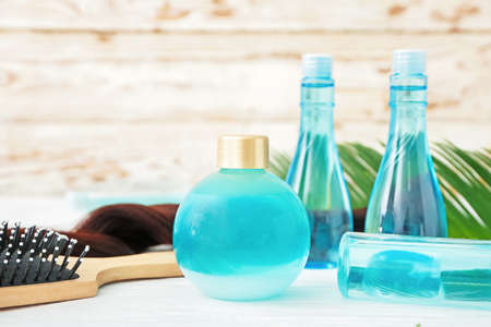 Cosmetics for hair on white table