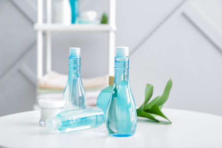 Cosmetics for hair on table in bathroomの写真素材