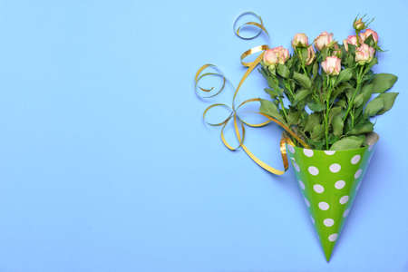Birthday hat with flowers on color backgroundの写真素材
