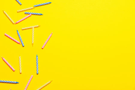 Candles for birthday cake on color backgroundの写真素材