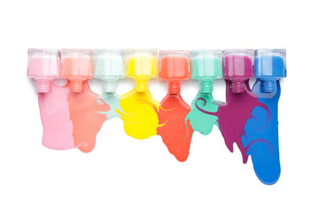 Spilled nail polishes on white backgroundの写真素材
