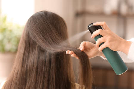 Hairdresser working with client in beauty salonの写真素材