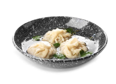 Plate with tasty dumplings on white backgroundの写真素材