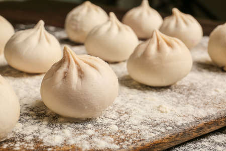 Board with raw dumplings, closeupの写真素材