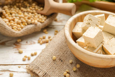 Bowl with tasty tofu cheese on table, closeupの写真素材