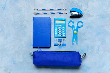Pencil case and school stationery on color backgroundの写真素材