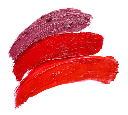 Strokes of bright lipsticks on white backgroundの写真素材