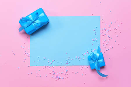 Birthday gifts and blank card on color backgroundの写真素材