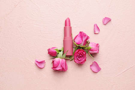 Lipsticks and flowers on color backgroundの写真素材