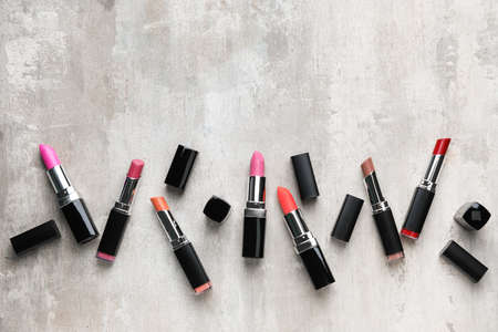 Different lipsticks on light background