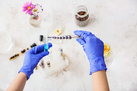Woman preparing perfume on table, top viewの写真素材
