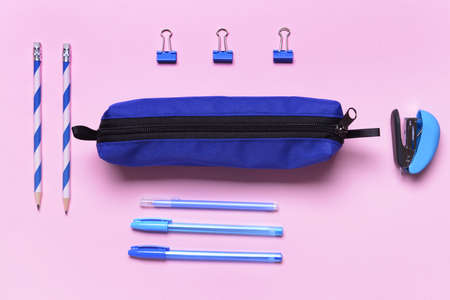 Pencil bag with stationery on color backgroundの写真素材