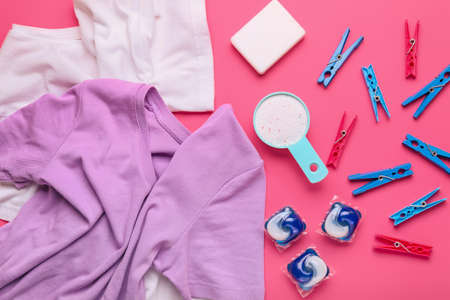 Composition with clothes and laundry detergents on color backgroundの写真素材