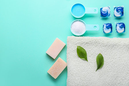 Towel and laundry detergents on color backgroundの写真素材