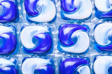 Many capsules with laundry detergent as backgroundの写真素材