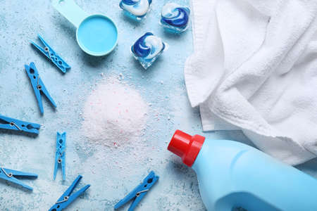 Composition with clothes and laundry detergents on color backgroundの写真素材