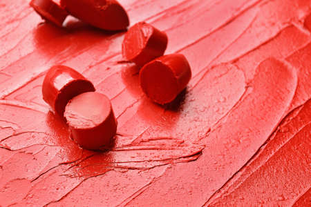 Bright red lipstick with pieces, closeupの写真素材