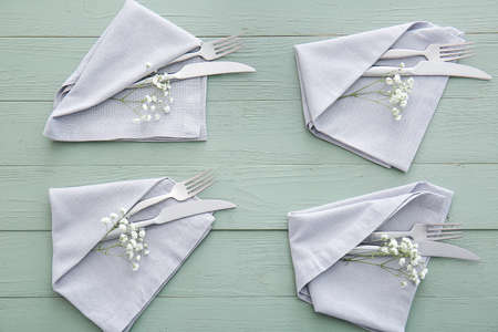Beautiful table setting with floral decor on wooden background