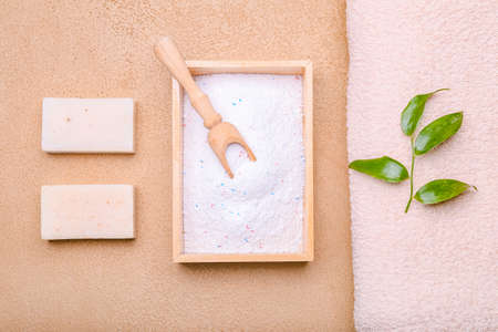 Towel, soap and laundry detergent on color backgroundの写真素材