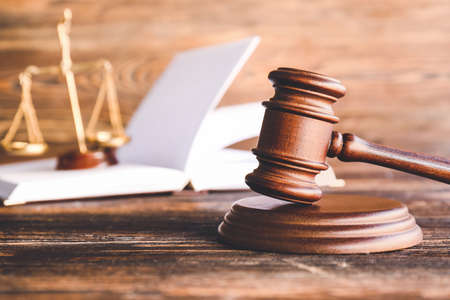 Judge's gavel on wooden background