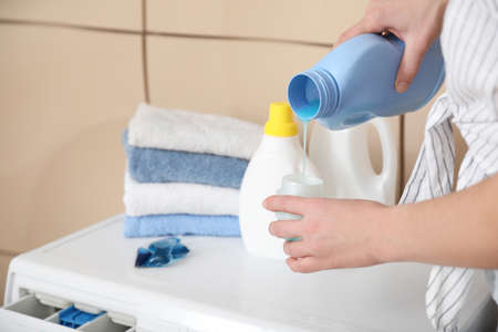 Woman doing laundry at home, closeupの写真素材