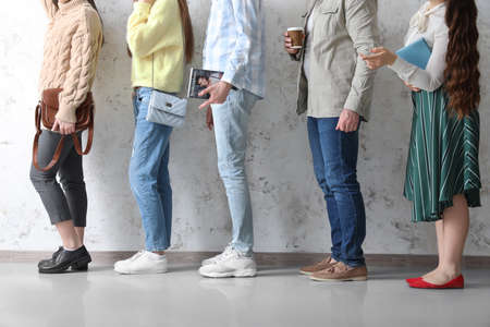 People waiting in line indoorsの写真素材