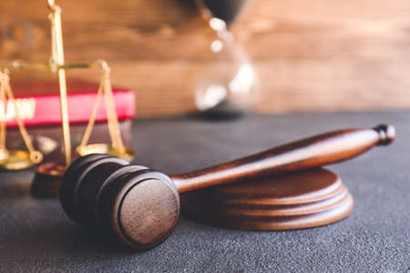 Judge's gavel on table in officeの写真素材
