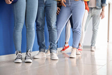 People waiting in line indoorsの写真素材