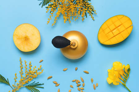 Beautiful composition with perfume bottle on color backgroundの写真素材