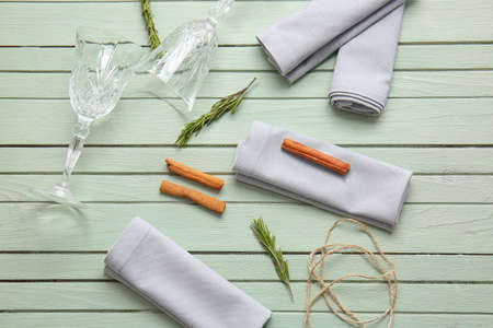 Napkins with floral decor and glasses on wooden backgroundの写真素材