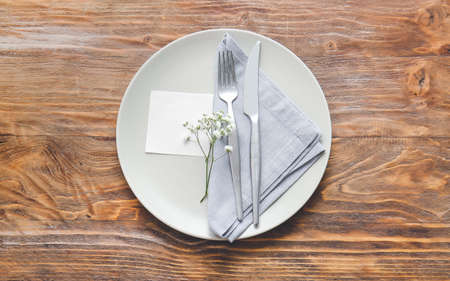 Simple table setting on wooden backgroundの写真素材