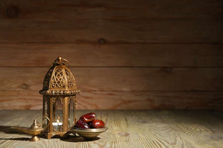 Muslim lamps and dates on wooden backgroundの写真素材