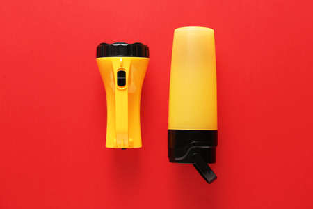 Modern flashlights on color backgroundの写真素材