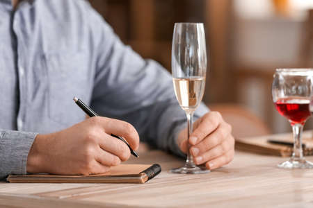 Man tasting wine at the restaurantの写真素材