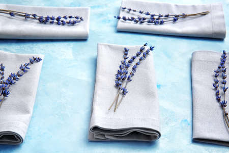 Napkins with floral decor on color backgroundの写真素材