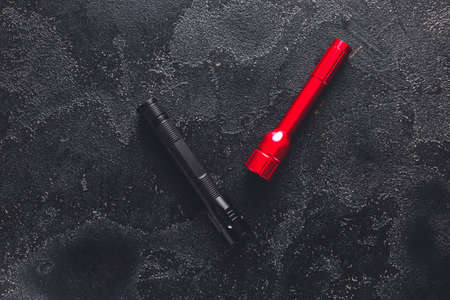 Modern flashlights on dark backgroundの写真素材