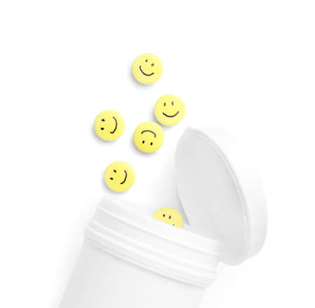 Bottle and pills with drawn happy faces on white backgroundの写真素材